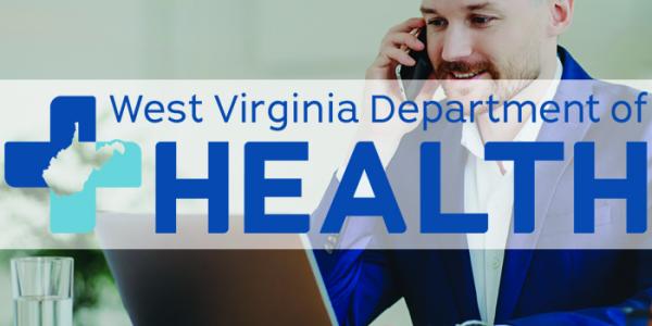 A man on the phone sits in front of a laptop. The WV Department of of Health logo is over the middle of the image. 