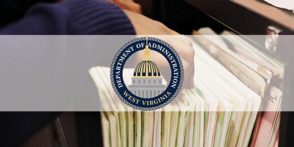 Dept. of Administration logo over a photo of someone filing information